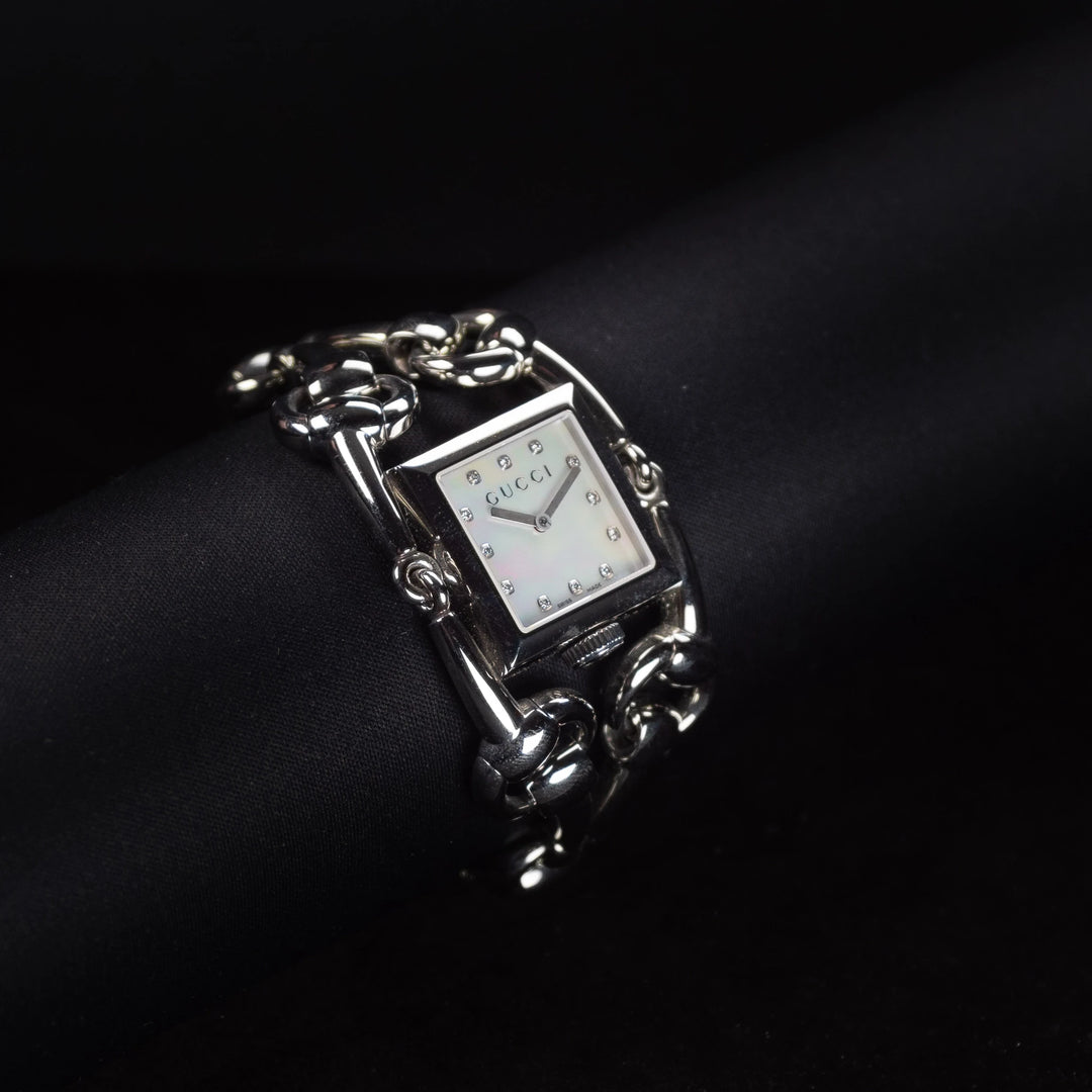 Luxury watch (YA116309): watch face angled view left zoomed out